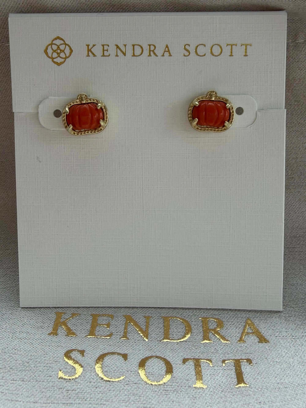 Kendra Scott's red pumpkin earrings